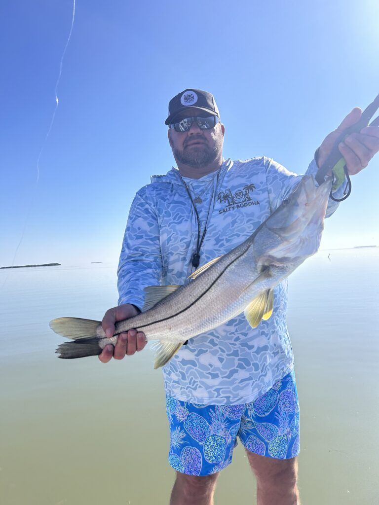 Captain Buddha with a snook on the flats